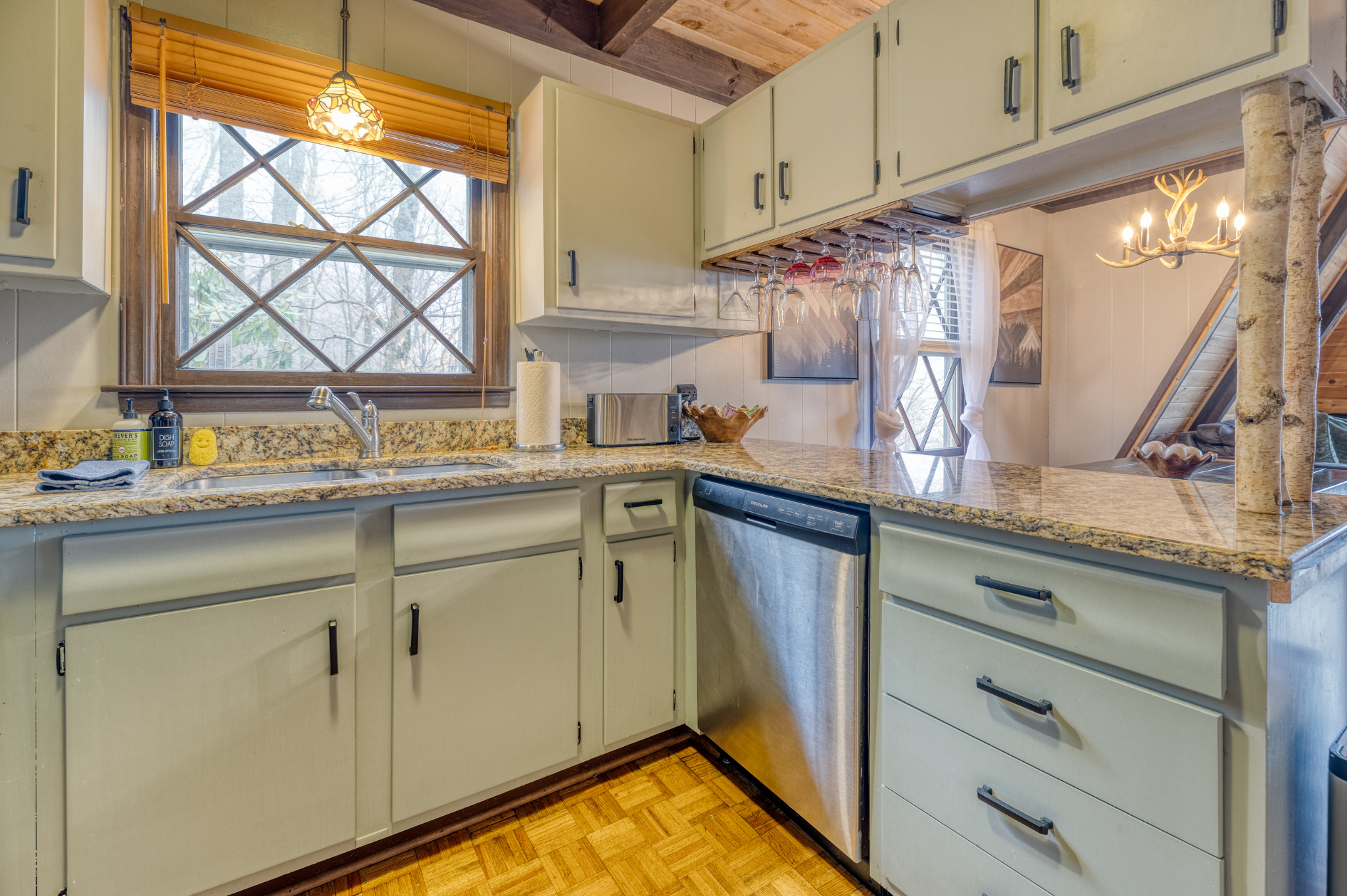 The kitchen, with granite countertops and stainless steel appliances, seamlessly connects to the dining area, making it perfect for entertaining.