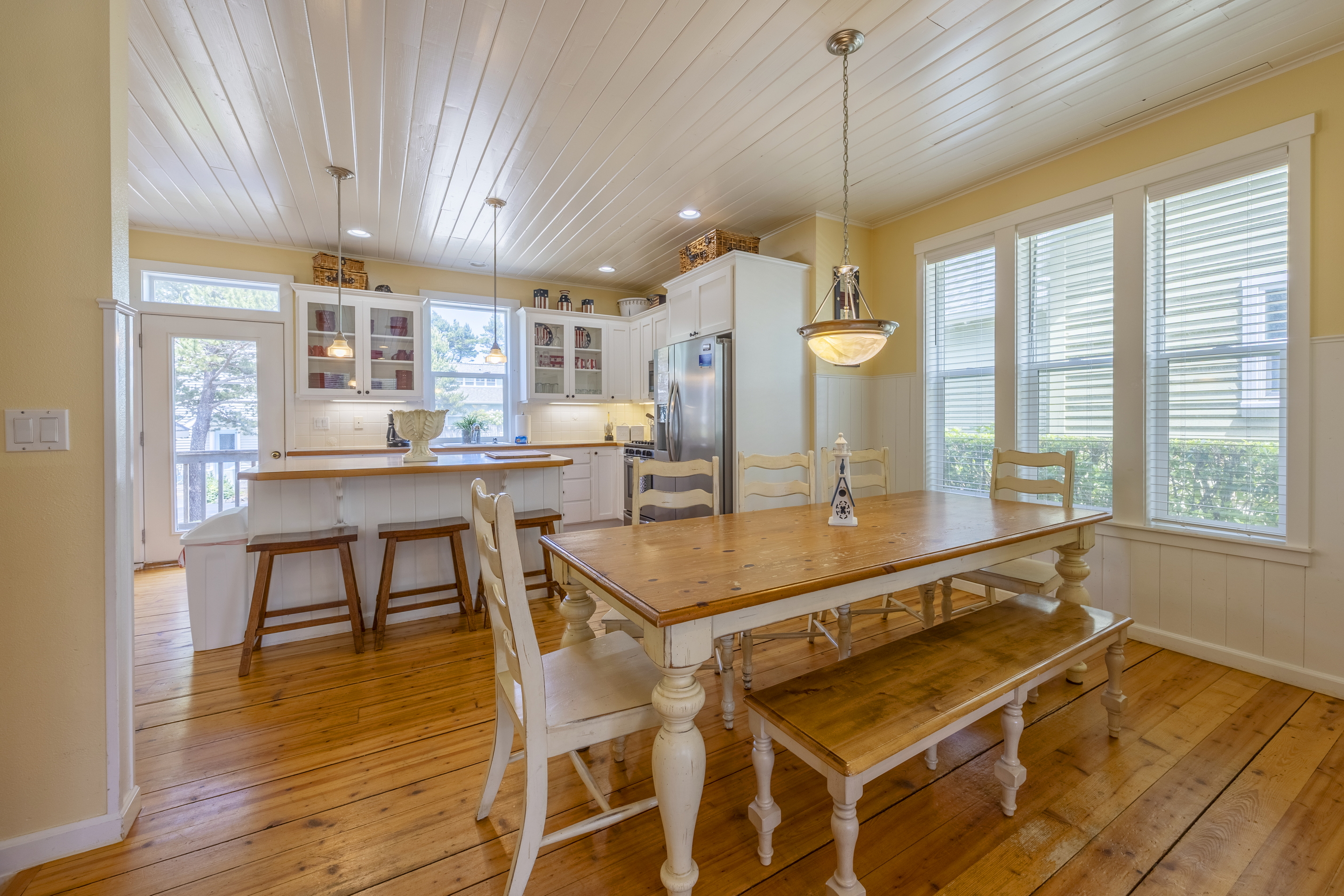 Gather around the farmhouse table for 8, with additional seating at the kitchen island for family and friends.