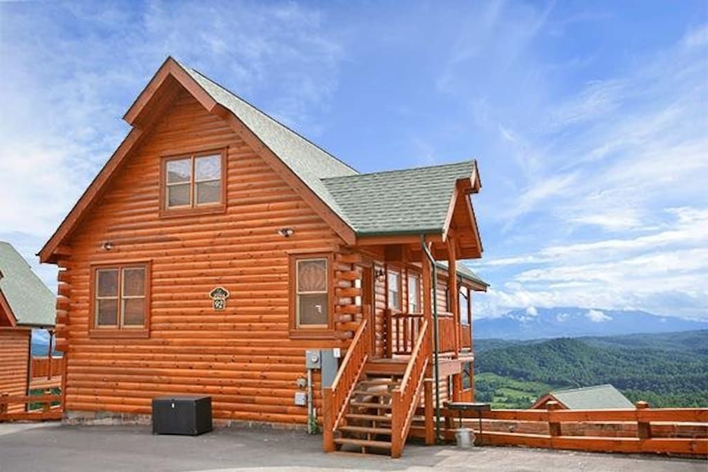 - Classic log cabin design with stunning Smoky Mountain backdrop welcomes your stay   - Spacious parking and easy access make arrival simple and relaxing   - A peaceful getaway surrounded by breathtaking mountain landscapes