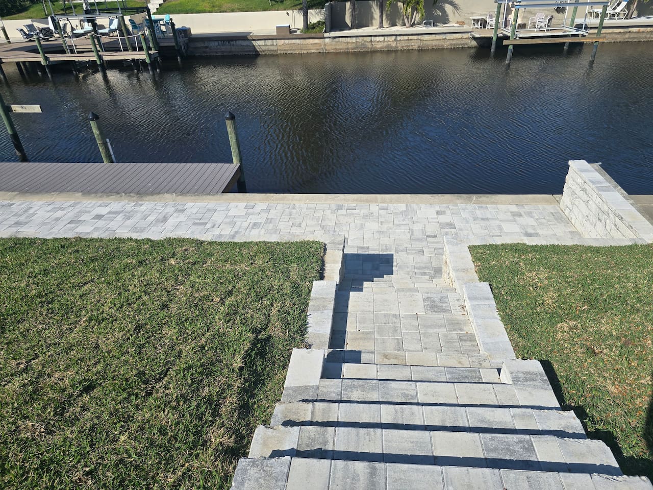 Brand -new paved stairs leading from the pool area to the boat dock
