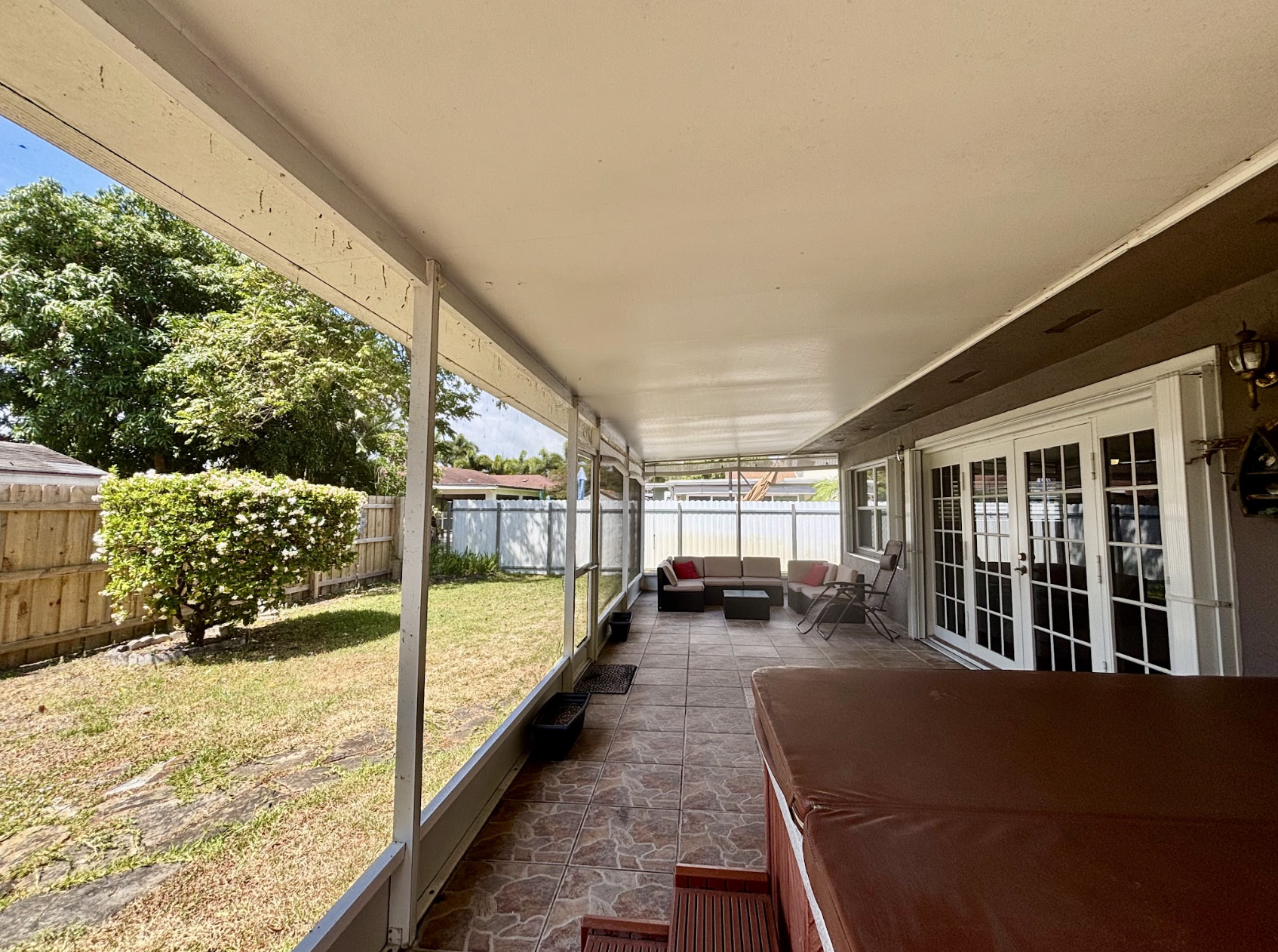 The sunroom is a great way to stay out of the heat while still enjoying all the green space.
