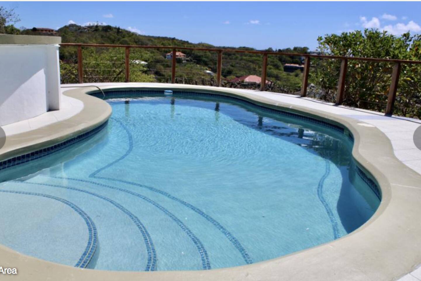 Cool off in the pool overlooking the Caribbean