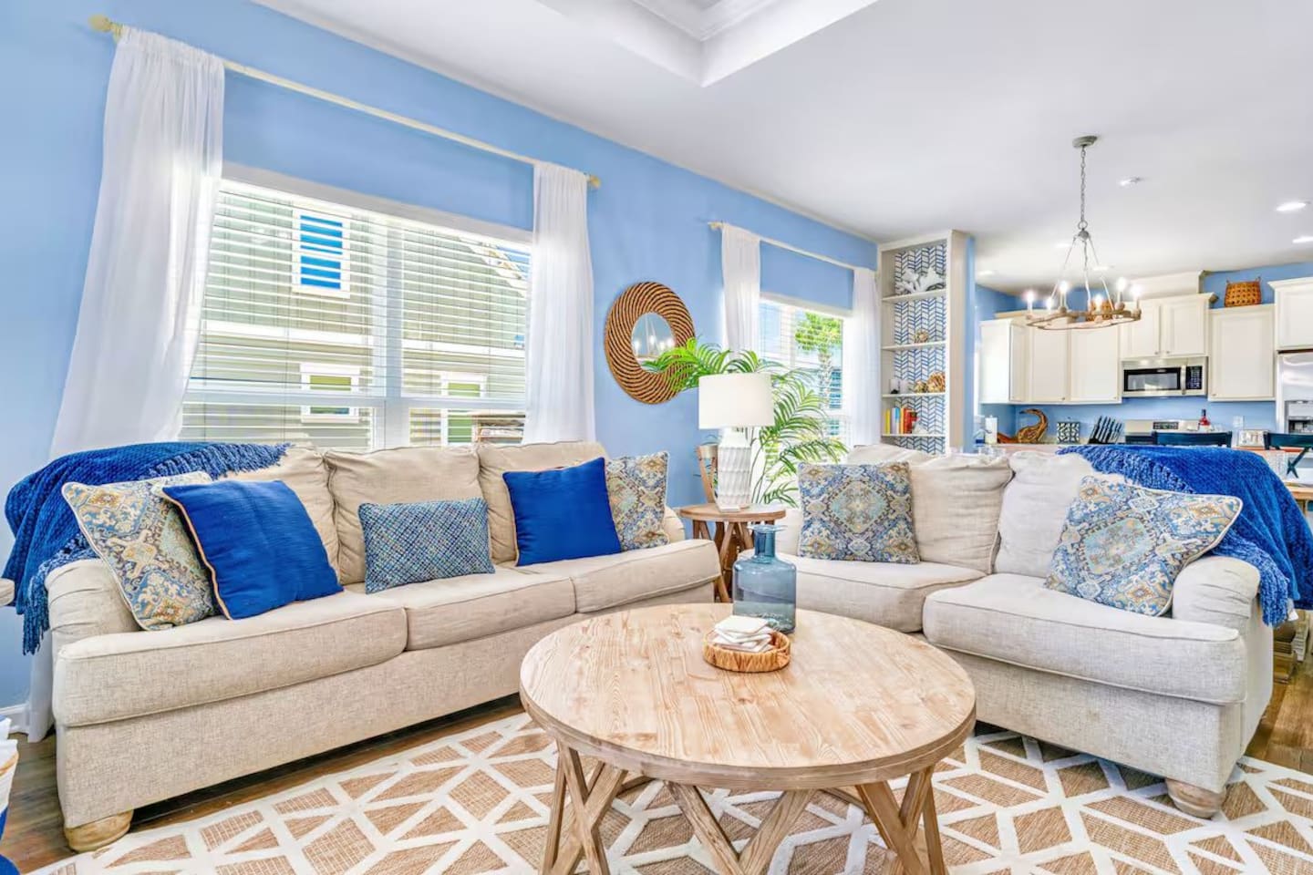 Relax in comfort. Bright and inviting living room with plush seating, perfect for movie nights or gathering with family and friends