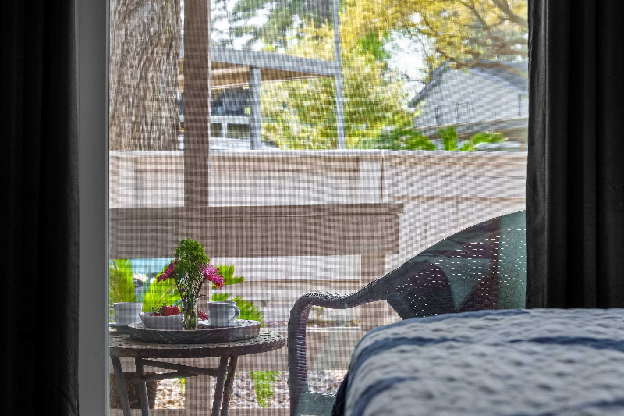 Step right outside the guest bedroom to a peaceful patio—ideal for sipping coffee, reading, or simply enjoying the fresh air.