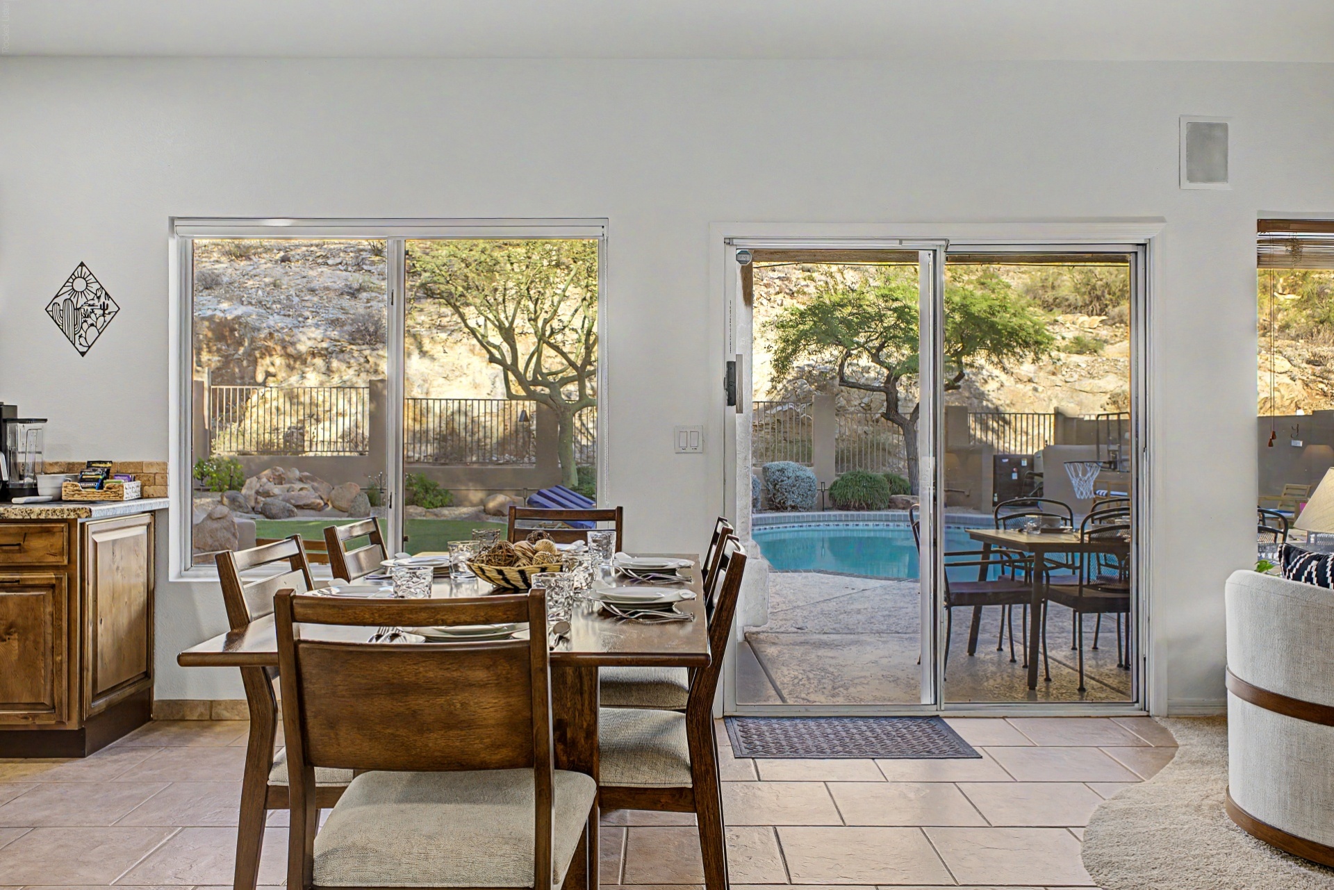Open concept kitchen and dining table with amazing backyard mountain view oasis