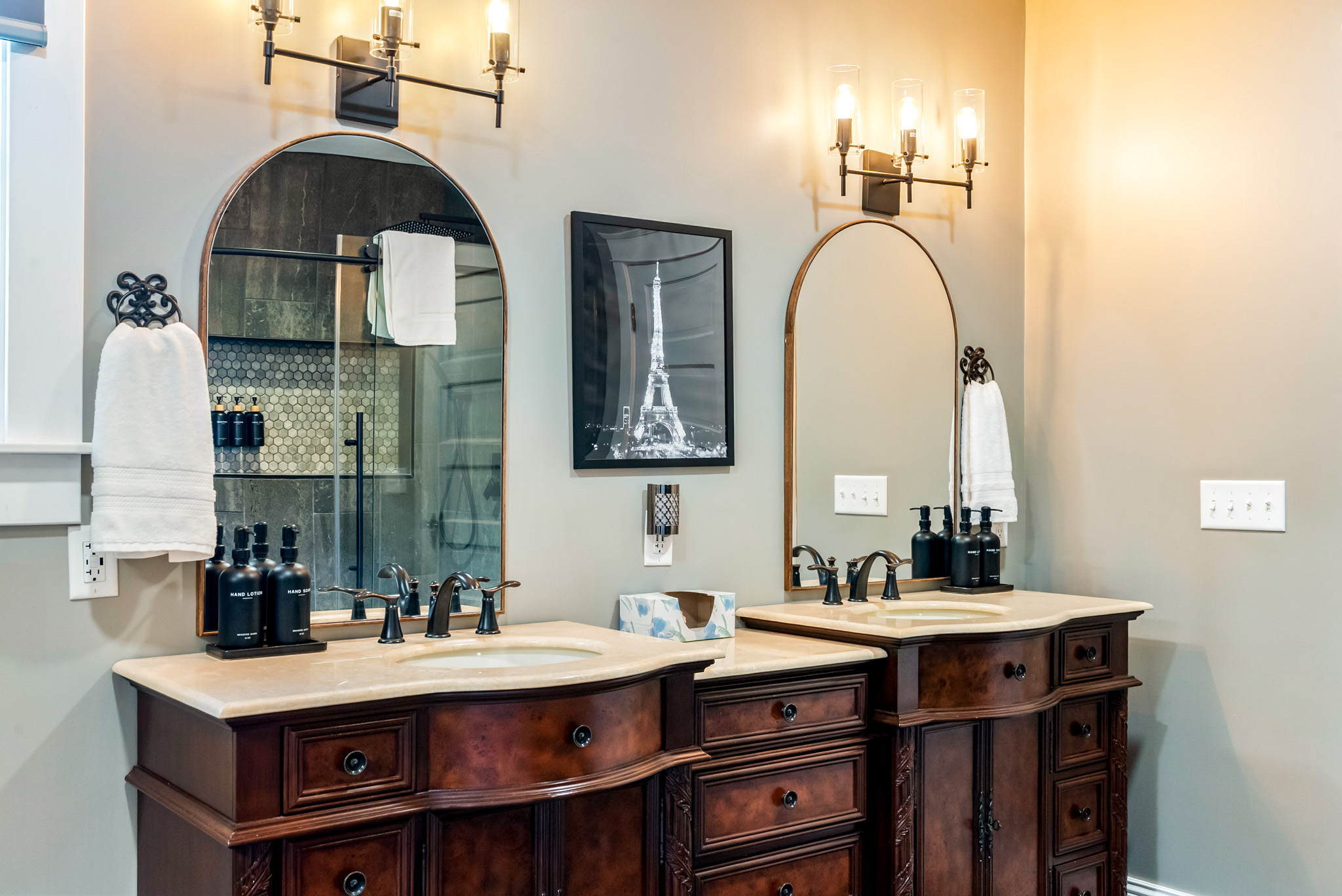 No morning rush here. The primary ensuite bathroom offers plenty of space with an elegant double vanity and beautiful design details.