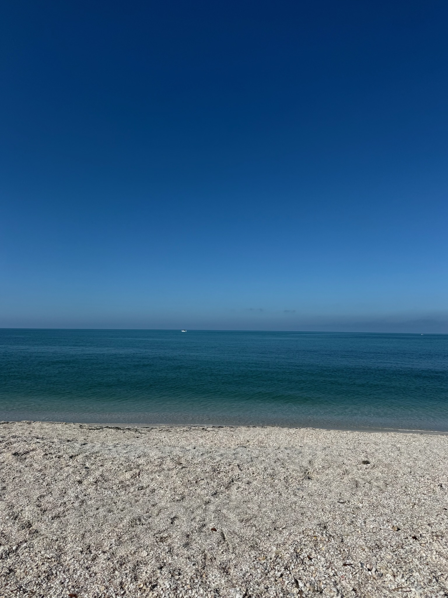 Some days the calm blue water blends right into the clear blue sky