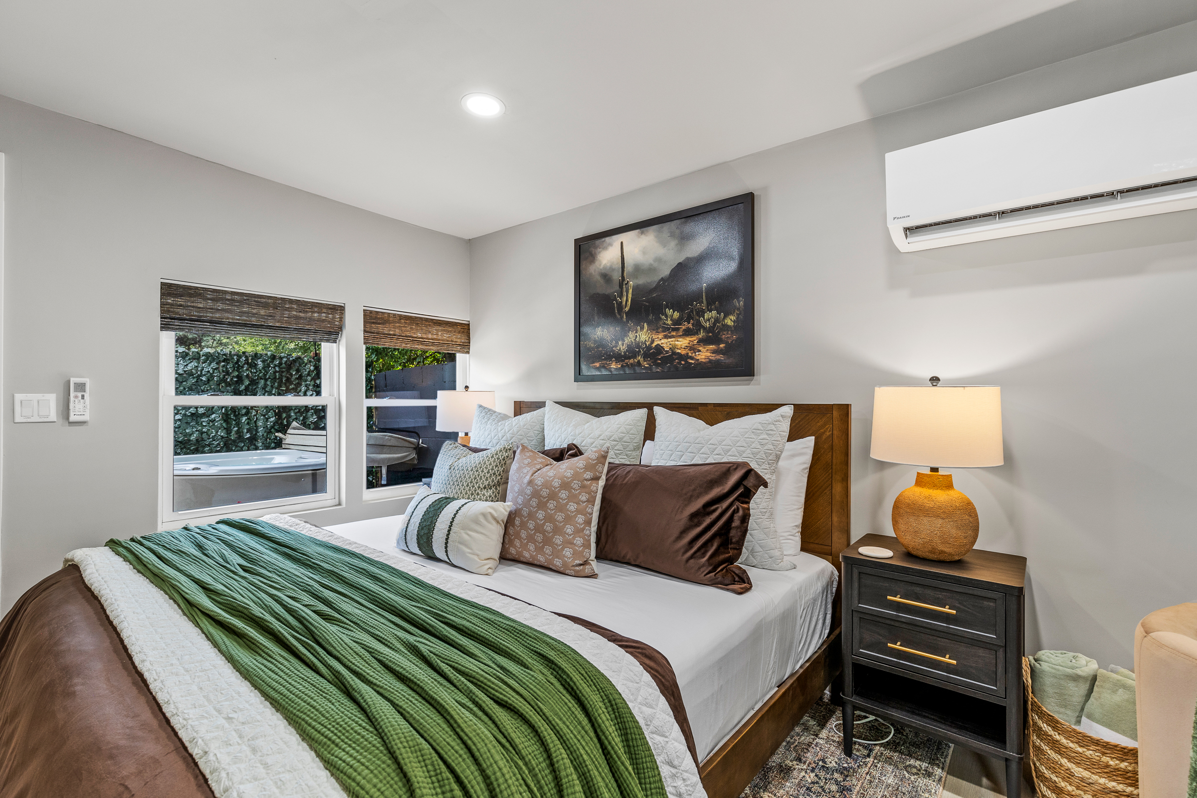 Drift off in a cozy king bed just steps from the hot tub - an inviting blend of indoor comfort and outdoor indulgence.