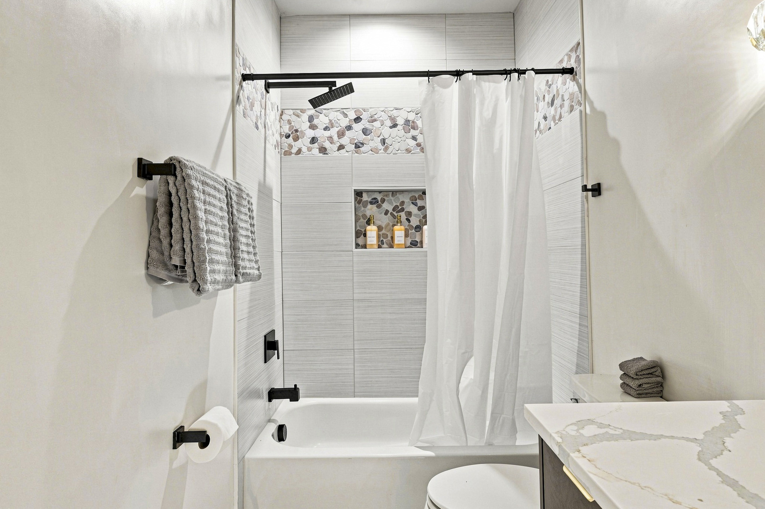 Modern elegance with stylish fixtures, perfect for your pampering retreat!