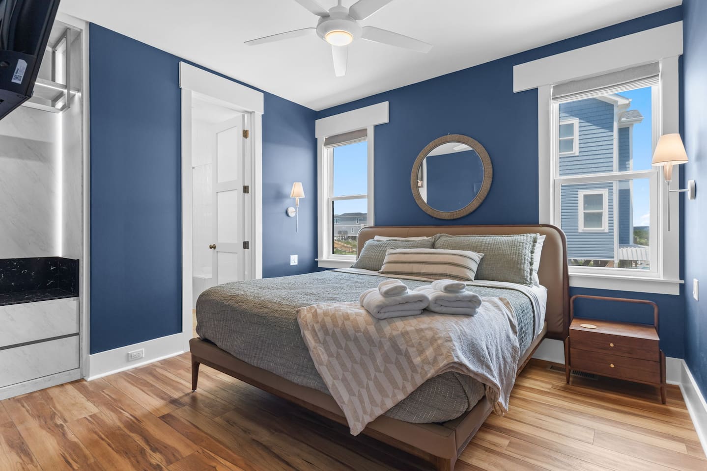 This bedroom is located just off the main living & dining space, so you're never too far away from the action! 