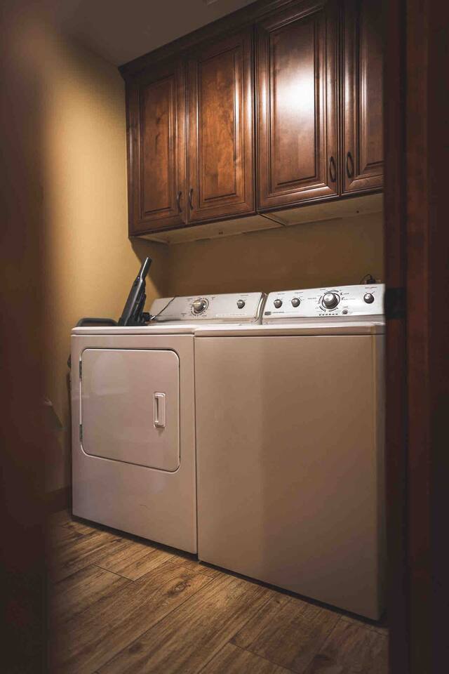 Laundry room with a full size washer and dryer