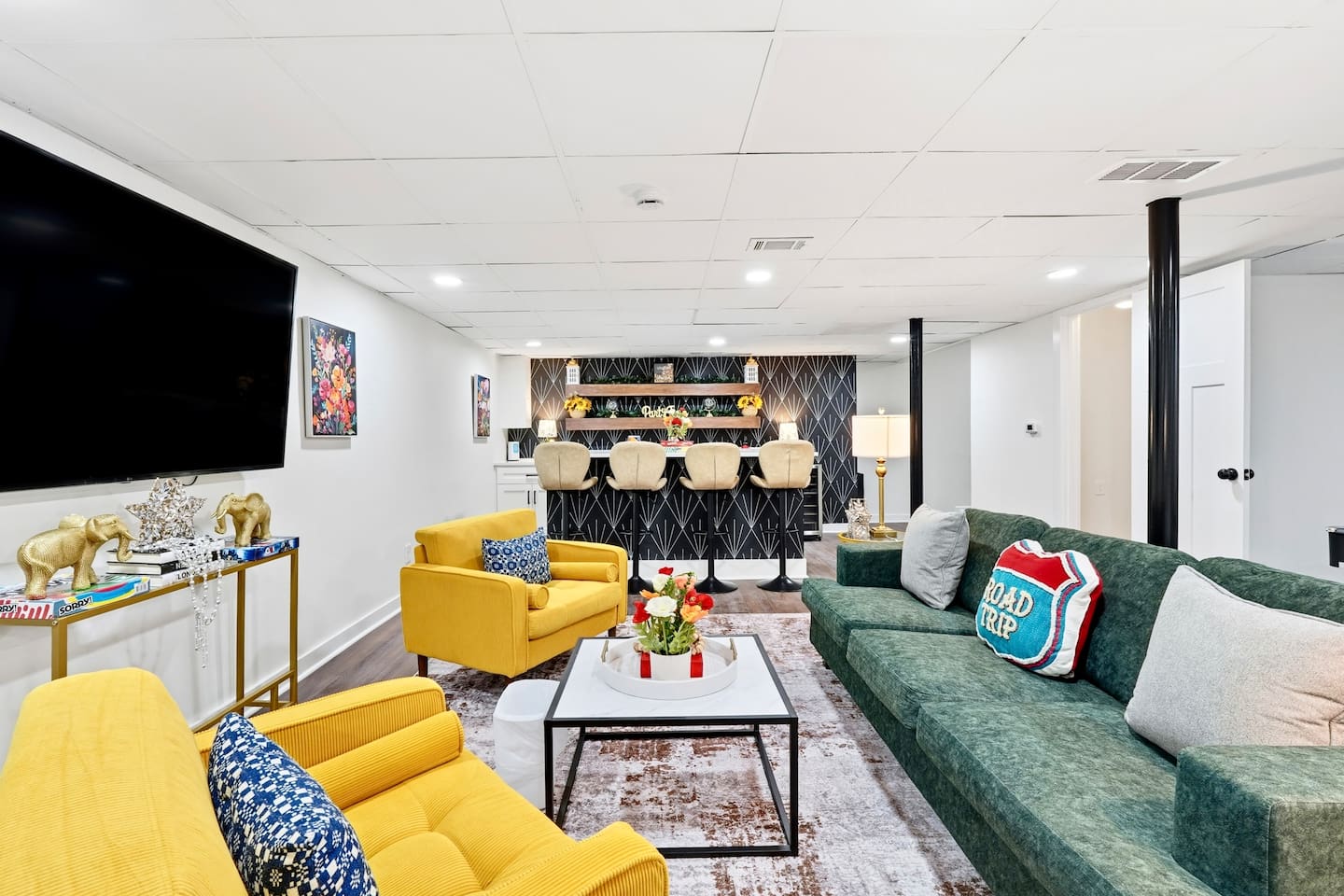 Amazing game room located in the basement, featuring a pool table, foosball table, and a stylish bar perfect for entertaining and relaxing with friends and family.