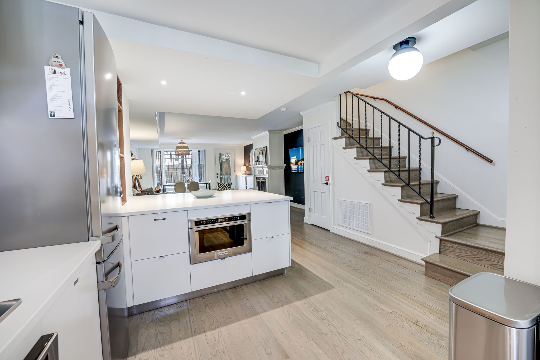 Kitchen Island & Stairs to 2nd Floor.