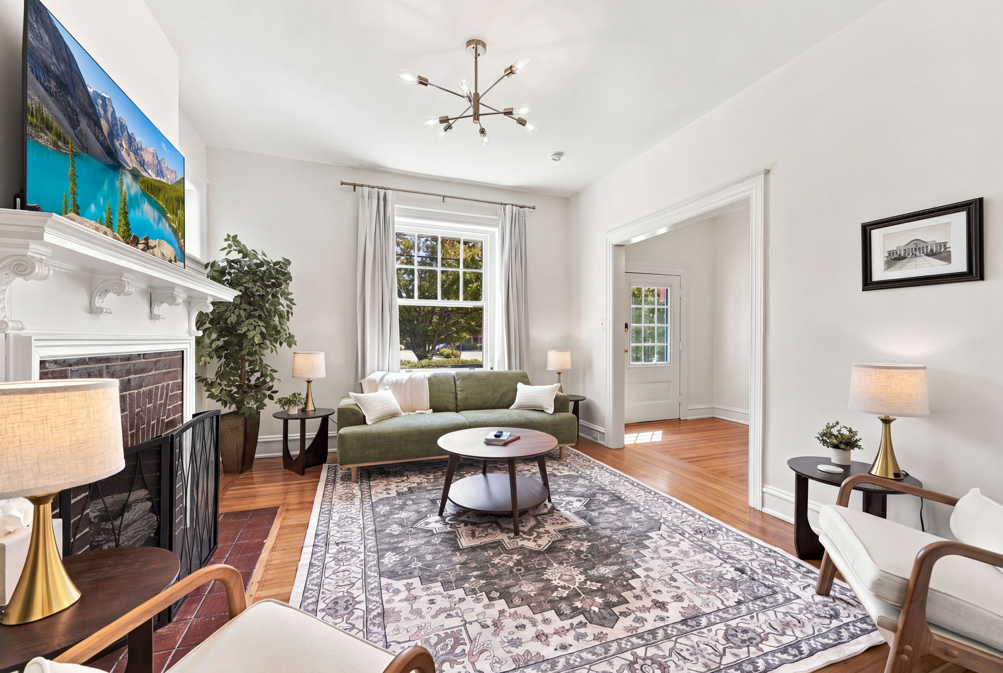 Living Room: Bright and inviting space with elegant furnishings and lovely views outside!