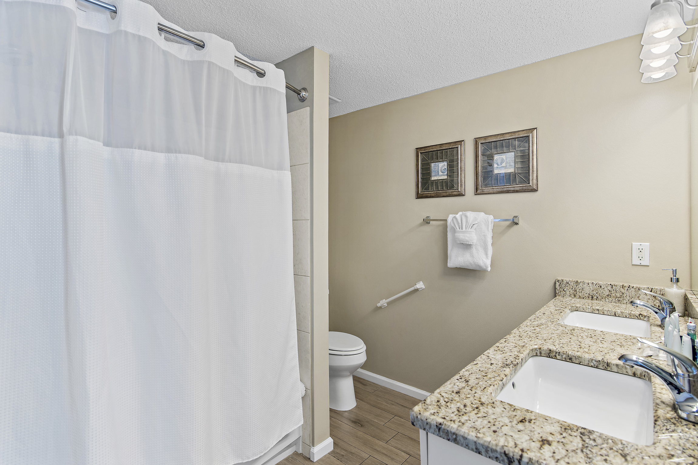 Bathroom 1 has dual vanities