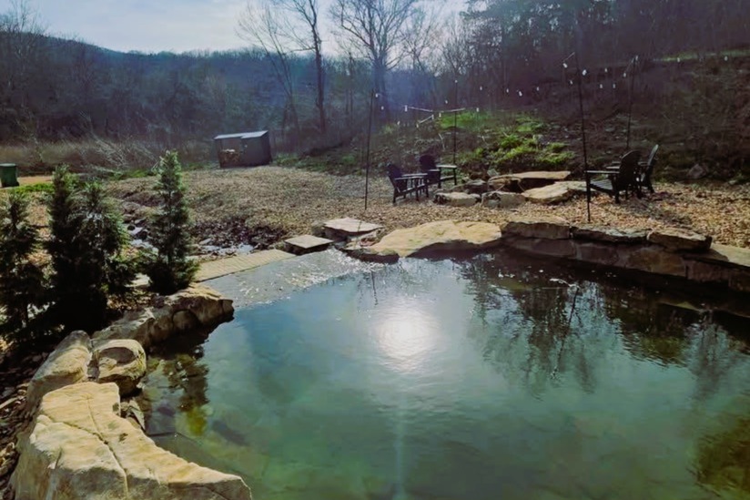 Natural Grotto Pool: Enjoy flowing water features fed by spring-fed private creek