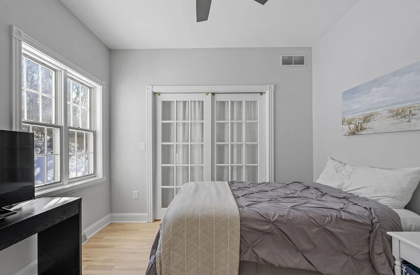 Comfortable first-floor bedroom with nearby bathroom access, offering easy convenience for guests who prefer main-floor living.