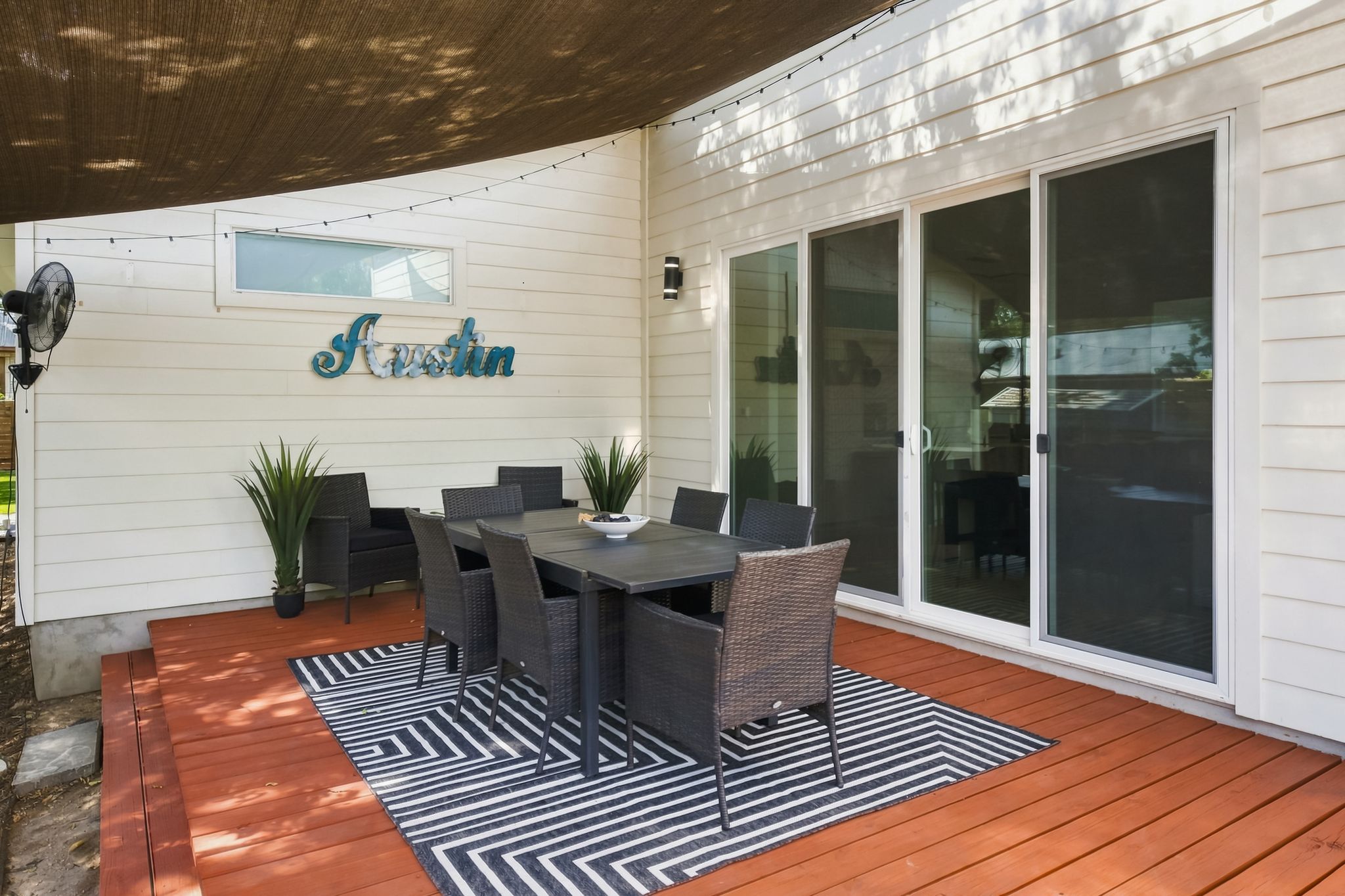 Outdoor seating for six under string lights!
