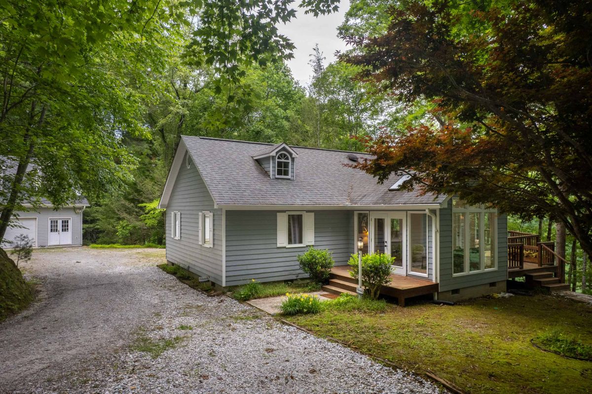 Charming Retreat: Nestled in nature, this inviting home offers serene views and a relaxing deck!