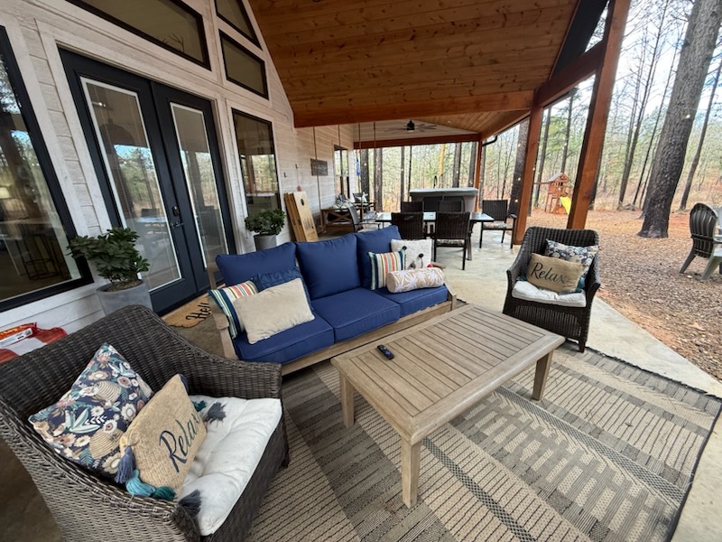 Relax and unwind in the cozy covered outdoor lounge.