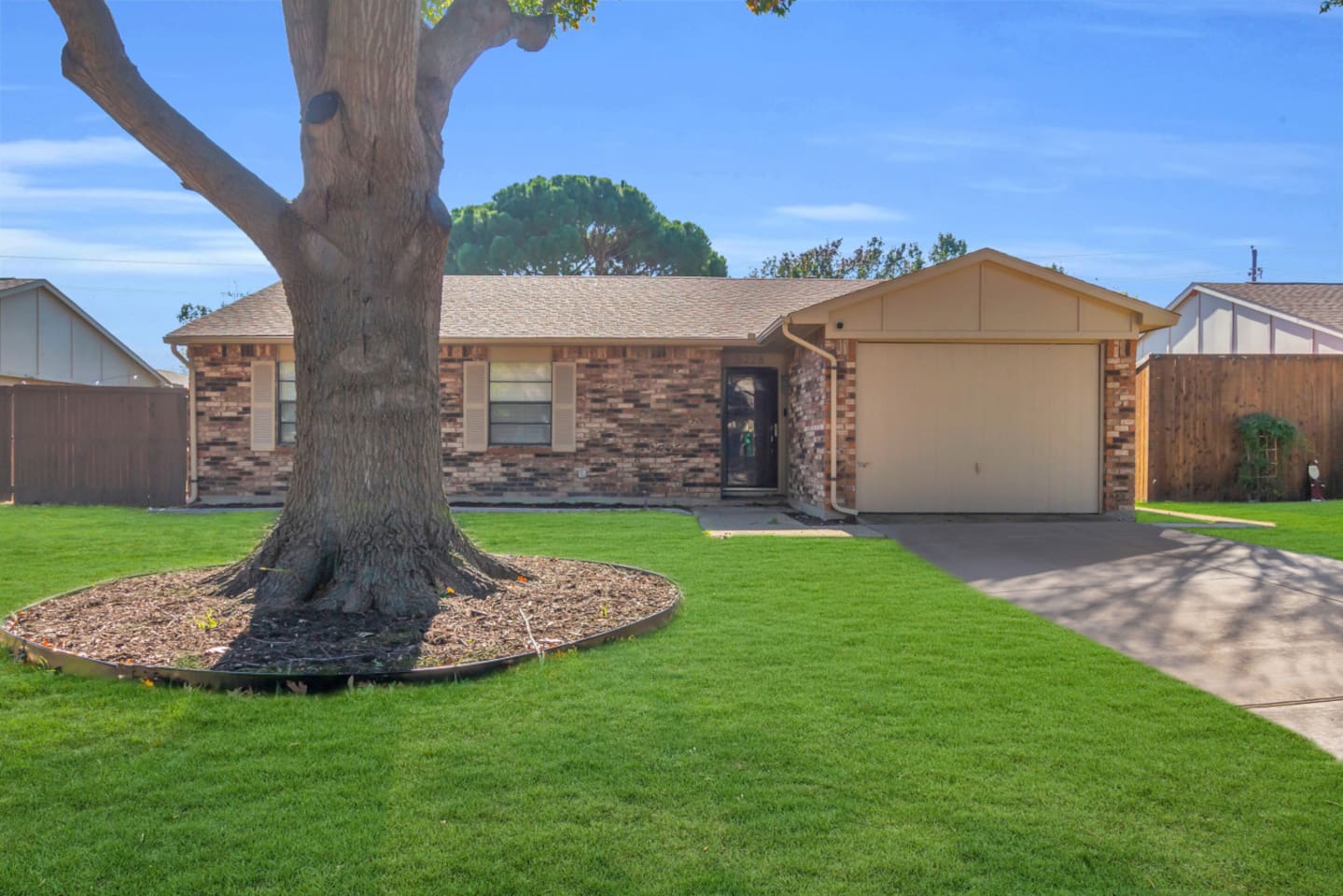 Welcome to your The Colony retreat, featuring a manicured front lawn and spacious driveway for convenient parking. A quiet, family-friendly neighborhood just minutes from Grandscape.