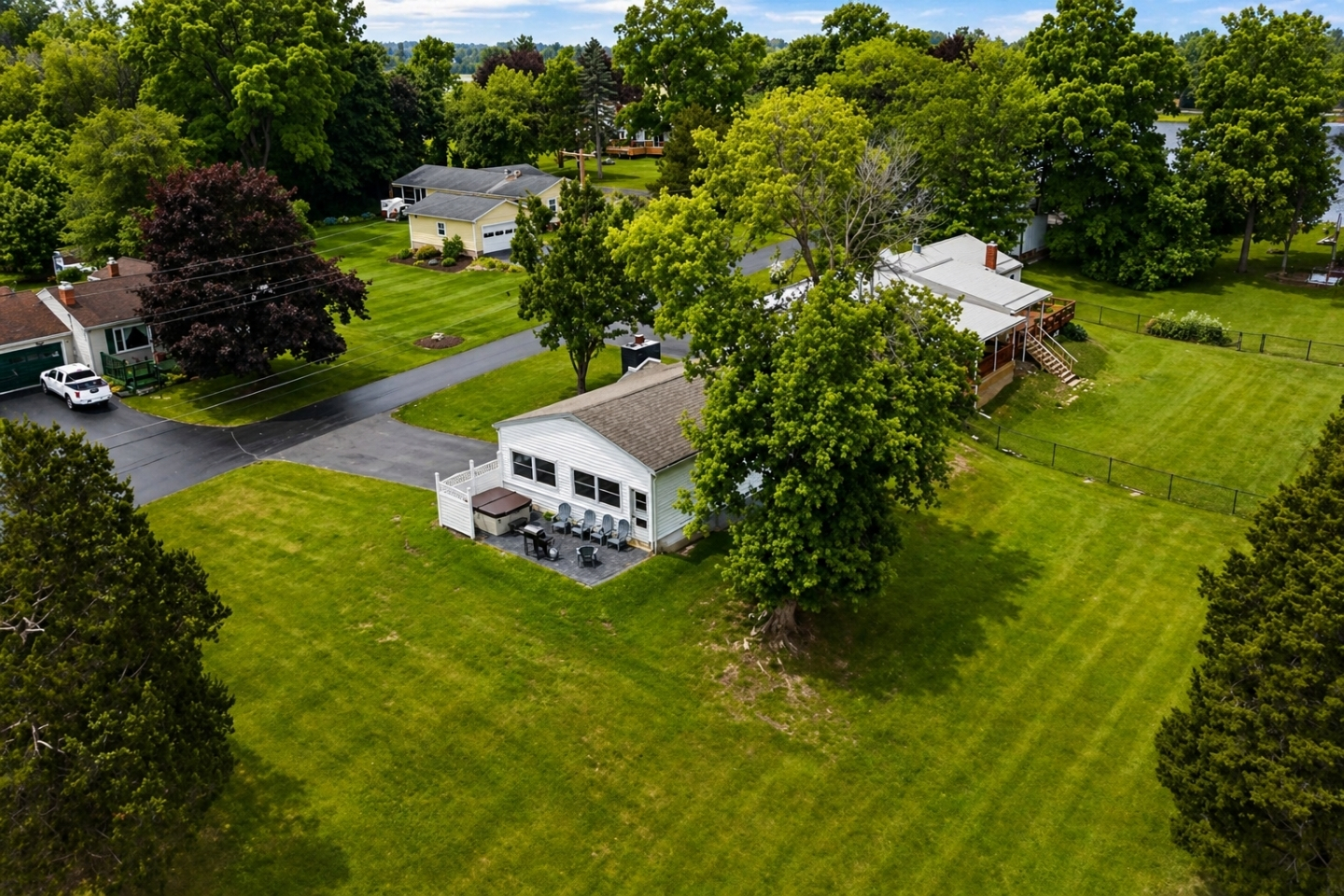 Charming single-story home with an attached garage, front patio, and a private fenced-in side yard. Enjoy a night time fire or a dip in the hot tub!