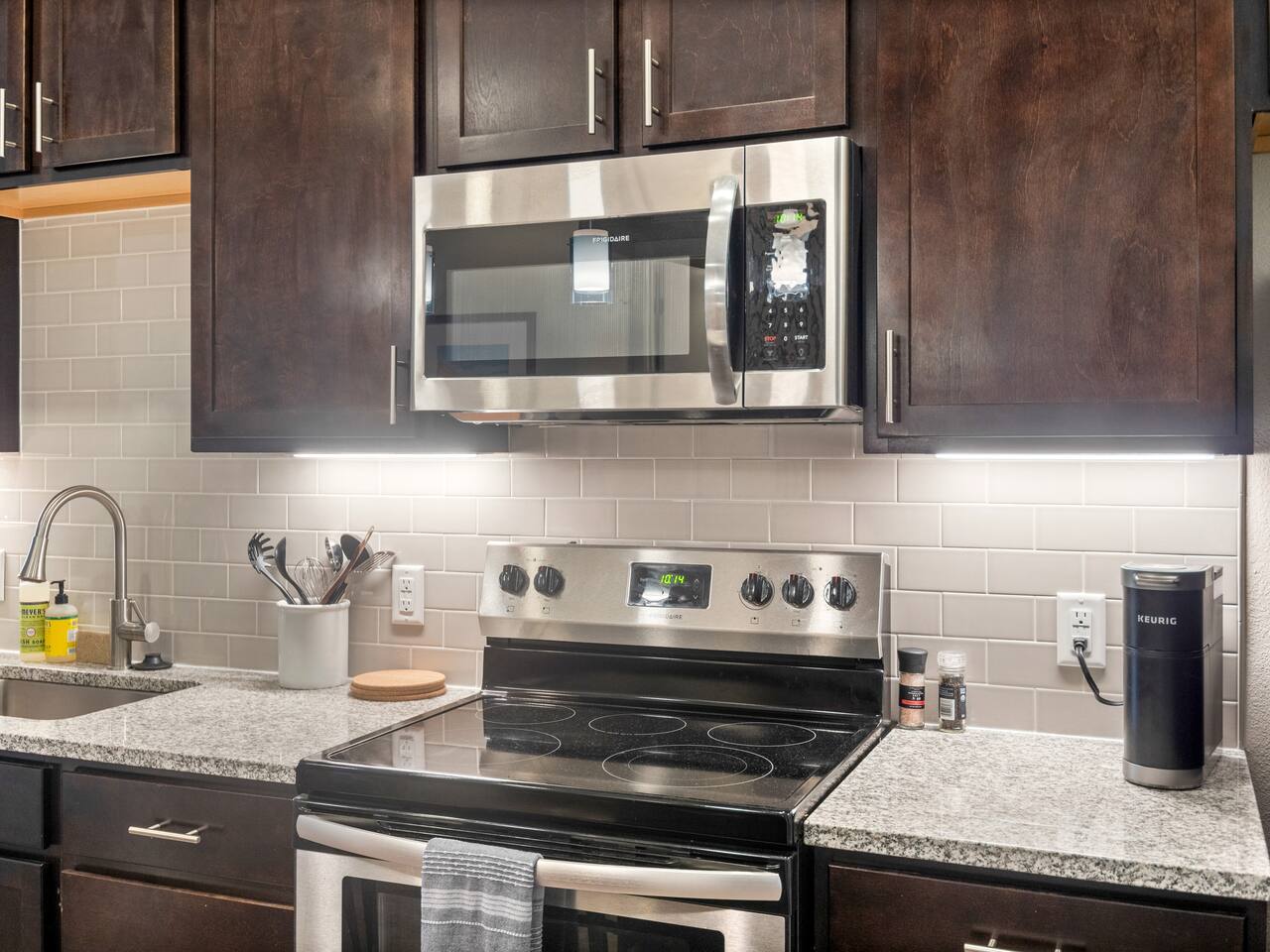 Fully stocked kitchen, complete pots, pans, utensils, spices, a Keurig and Keurig pods.