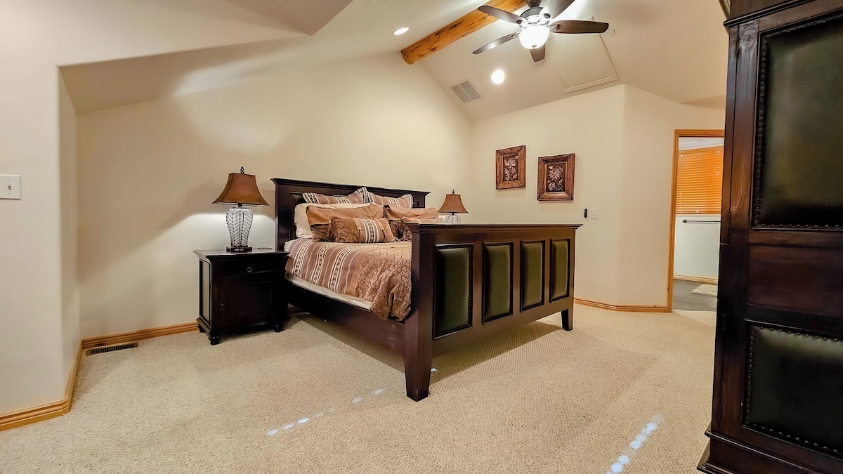 The primary bedroom suite boasts a luxurious king-sized bed, an ensuite bathroom and ample storage space.