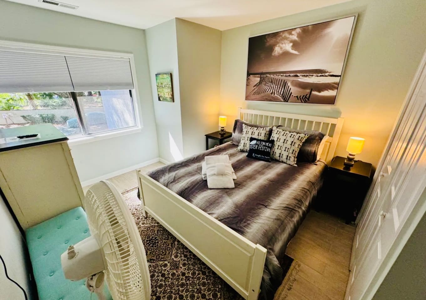 Bedroom with coastal art