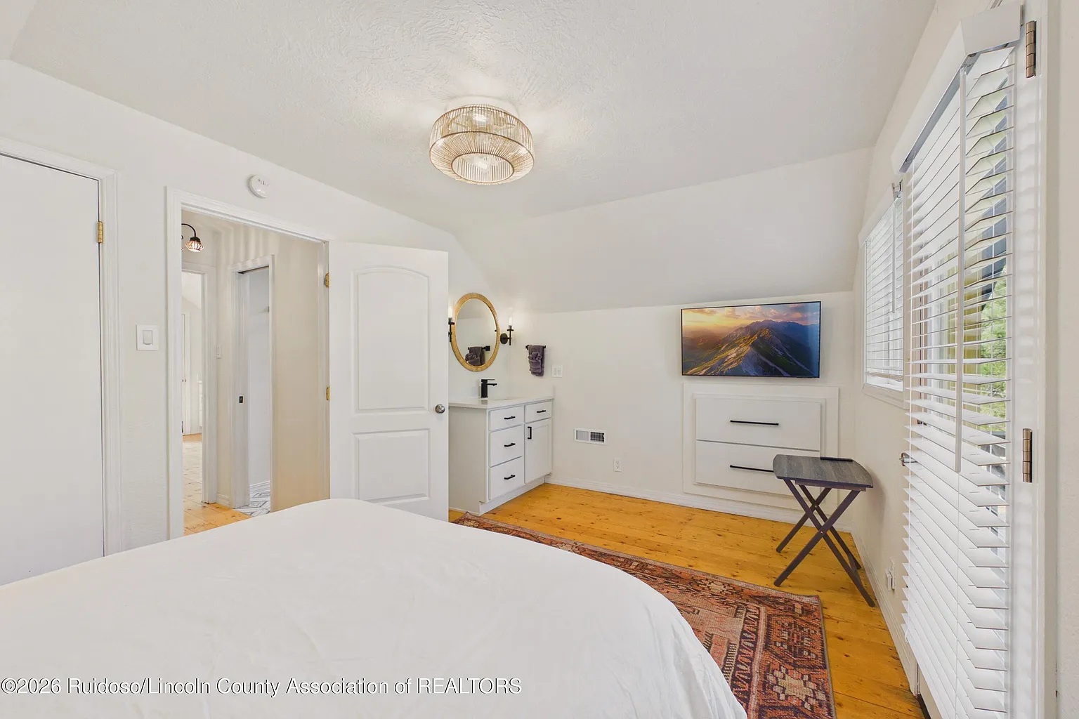 Upstairs bedroom with TV and private balcony