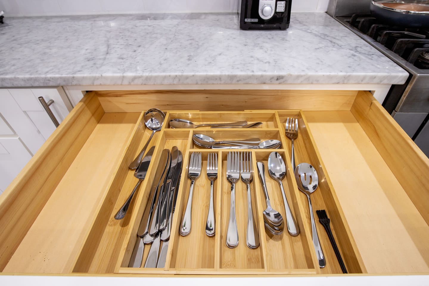 Luxuriate in the simplicity and elegance of our kitchen space, where clean lines and bright surfaces invite you to create, dine, and gather.