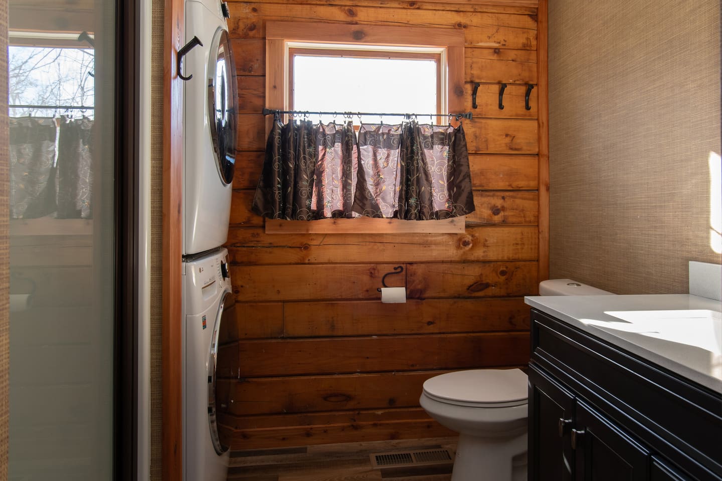 Laundry area in cabin with supplied laundry detergent.