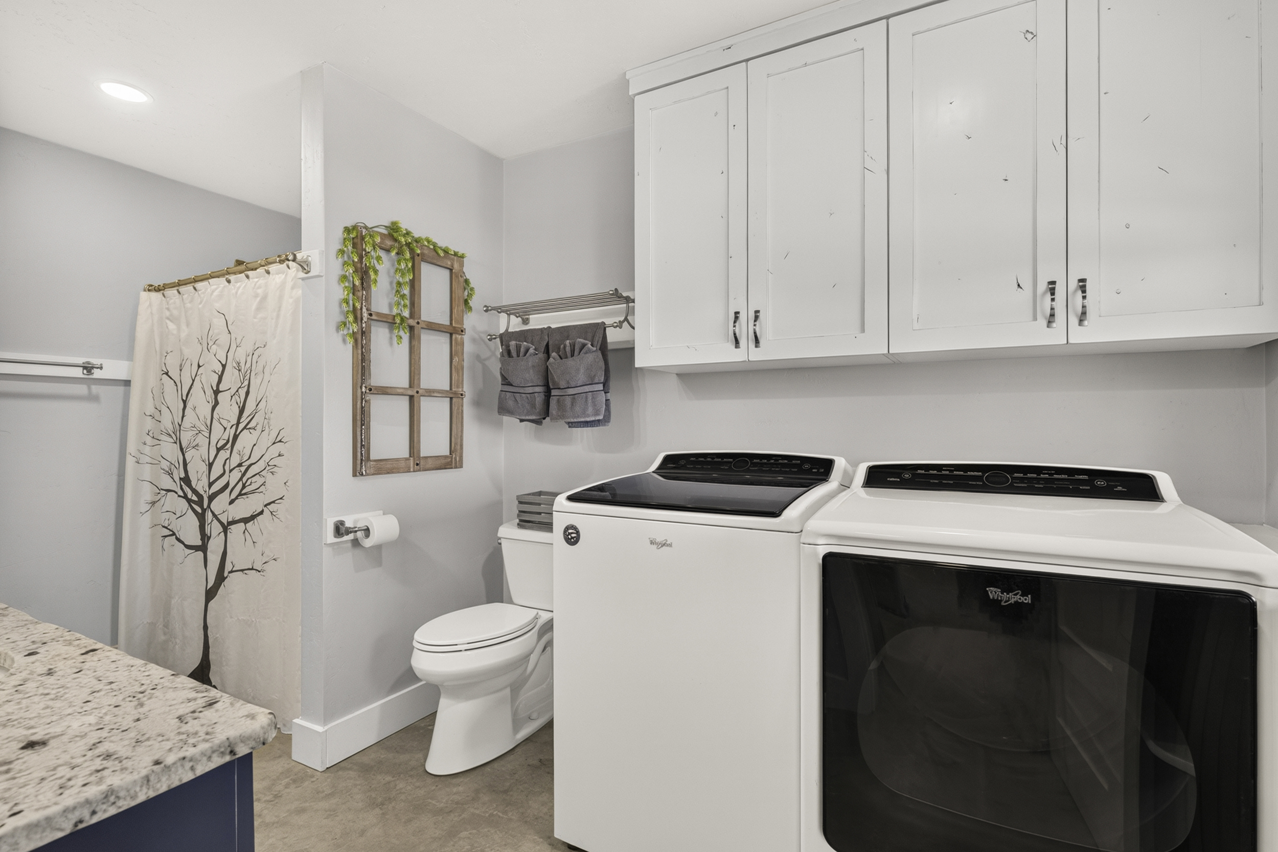 Laundry room/full bathroom on main level.