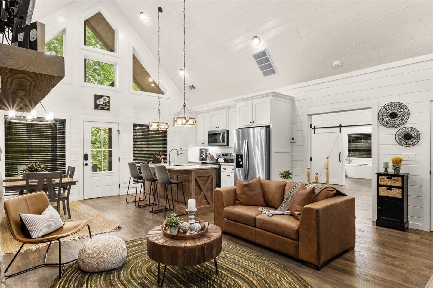 The open living area invites you to relax with coffee from Keurig or drip brew, enjoy the gas fireplace, and catch your favorite shows on the Smart TV.