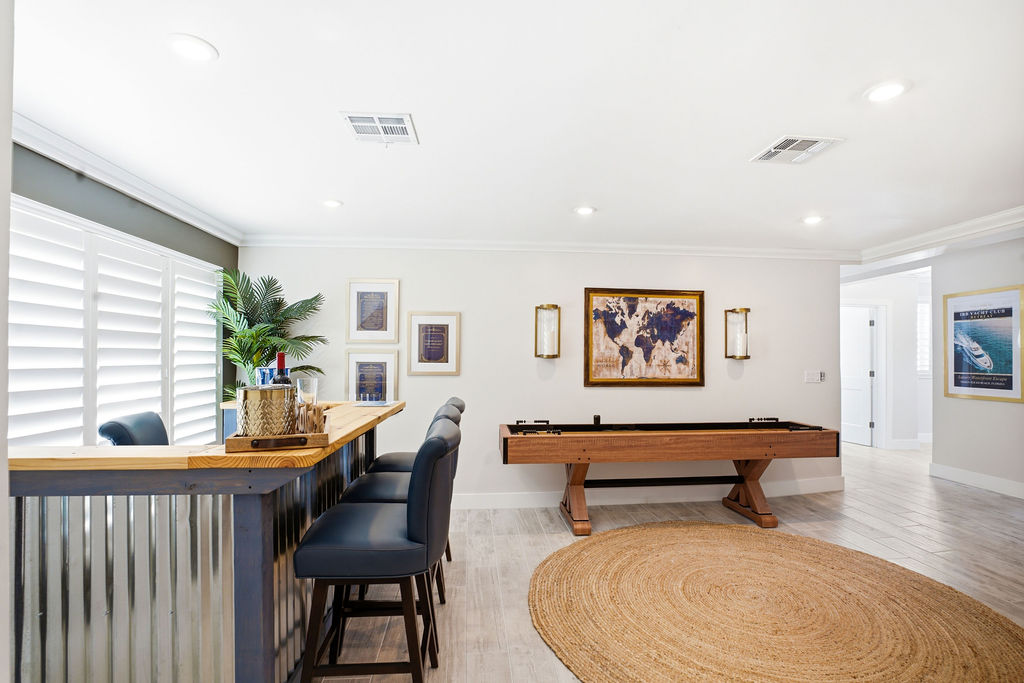Whether you're enjoying a round at the game table or pulling up a seat at the bar, this space is perfect for relaxing and keeping the good times rolling.