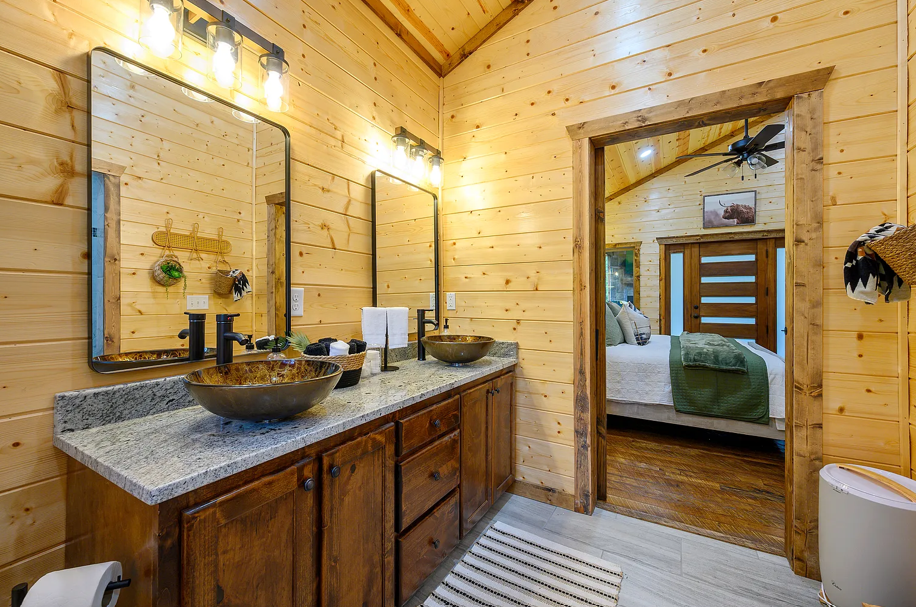 Stylish bathroom with double vanity and modern cabin-inspired finishes