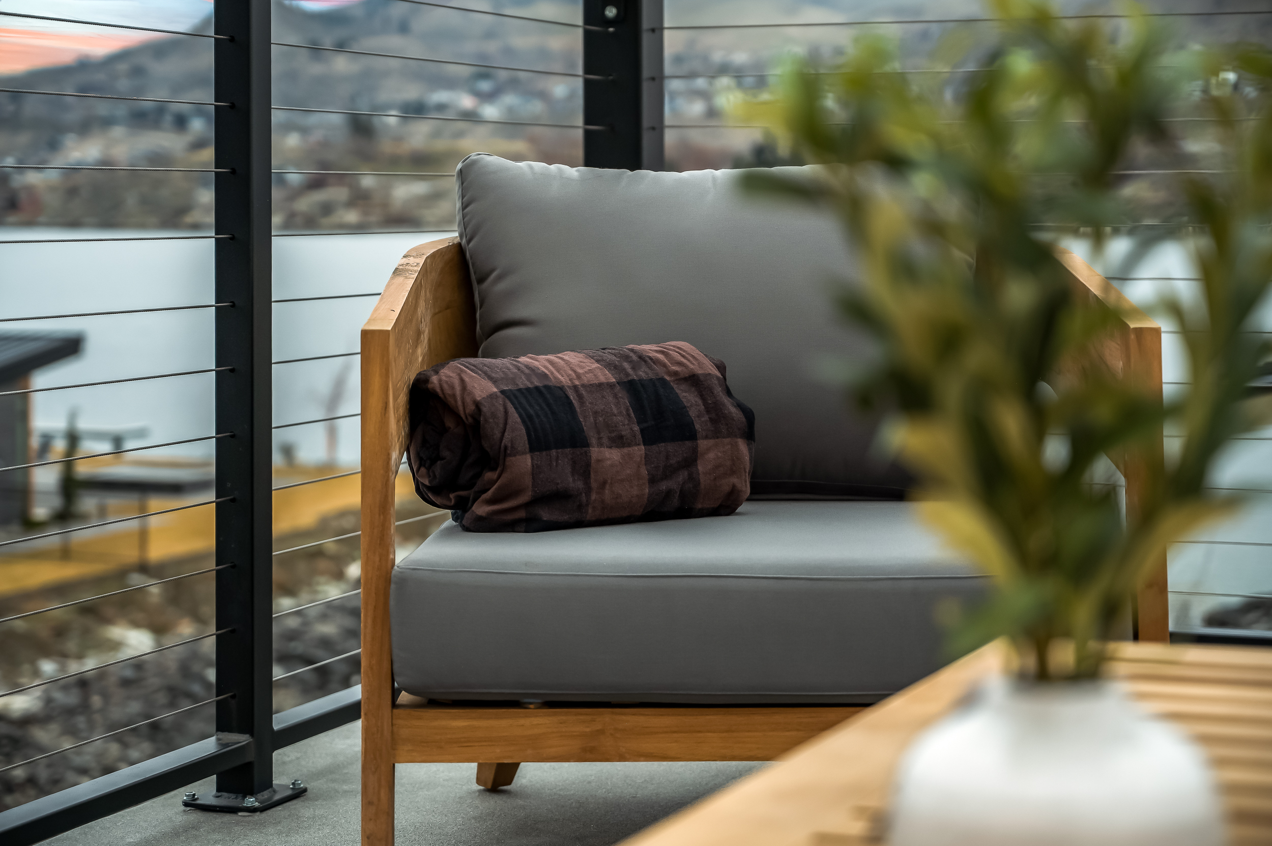 Rooftop deck with lounge seating, fire table and dining table