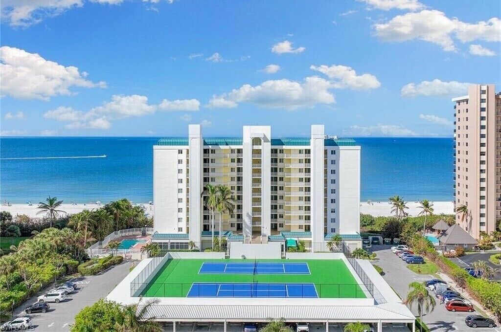 Building front view and tennis courts