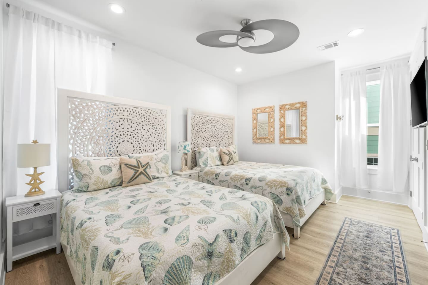 Experience 30A luxury in this serene guest suite featuring two unique Balinese-carved Queen beds.  Catch your favorite shows on the Smart TV and stay cool with the high end customer set AC and Supersonic fan  Includes an adjoining bathroom