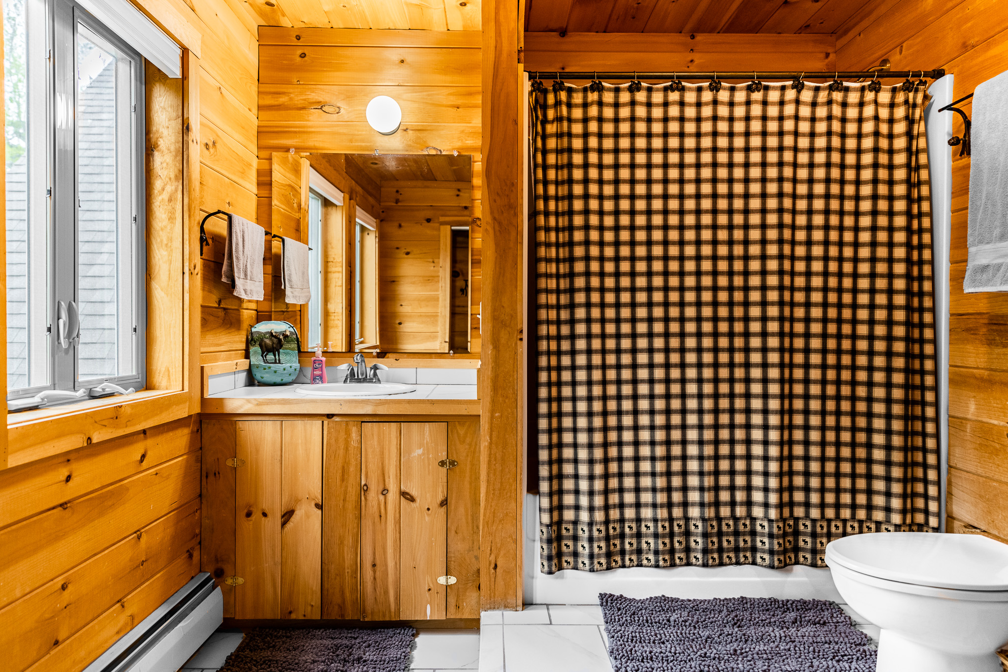 Enjoy another full suite upstairs with a full and 2 twin beds, full bathroom with large closets, charging station by your bed, TV for streaming, and all with lake views.