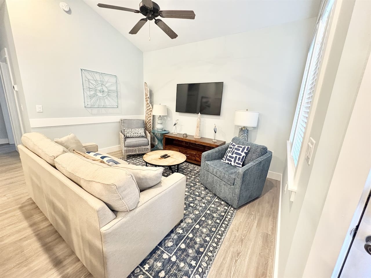 Comfortable living area featuring a queen-size sleeper sofa and smart TV