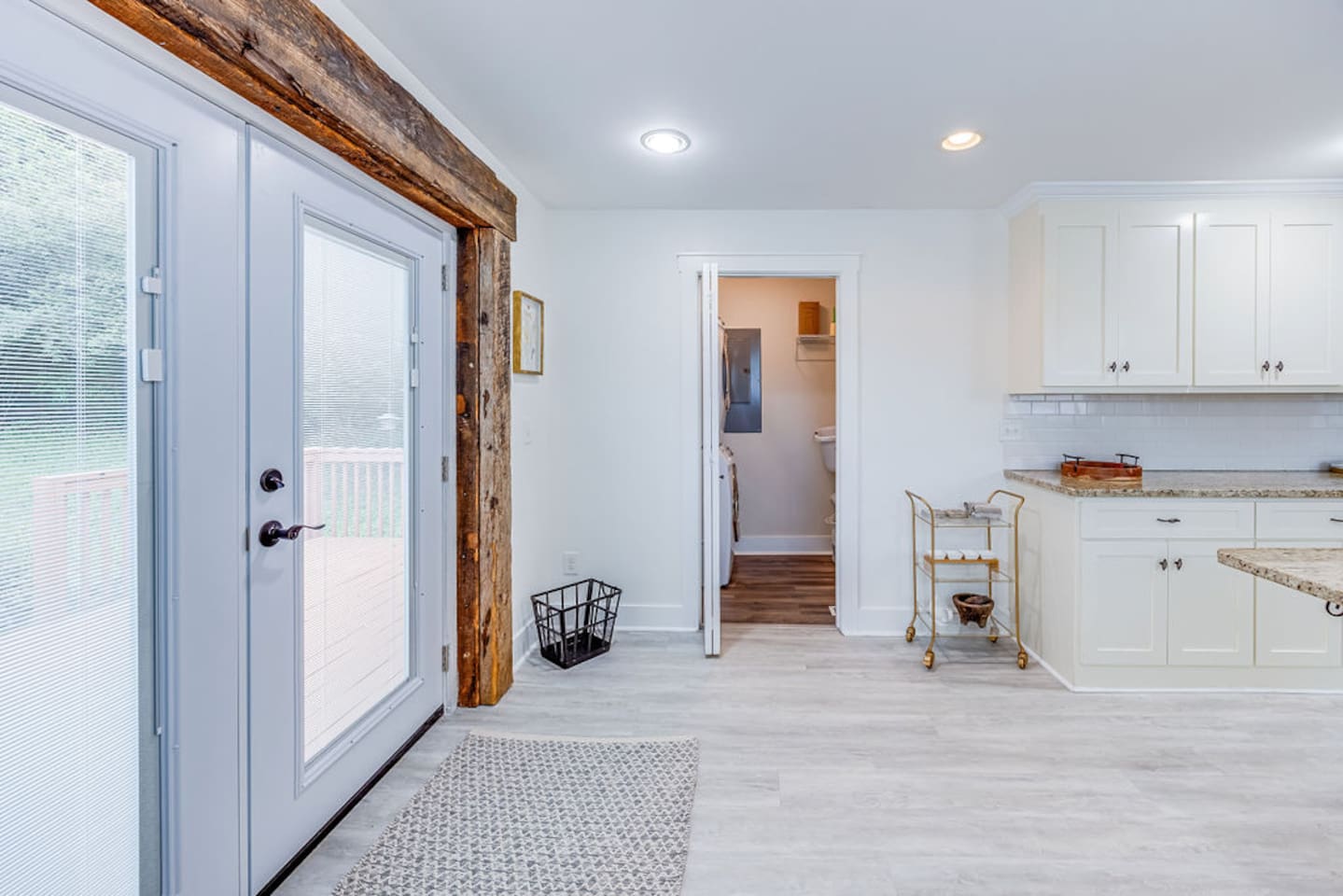 Door leading to the back of the house, offering easy access to outdoor spaces for relaxation or exploration.