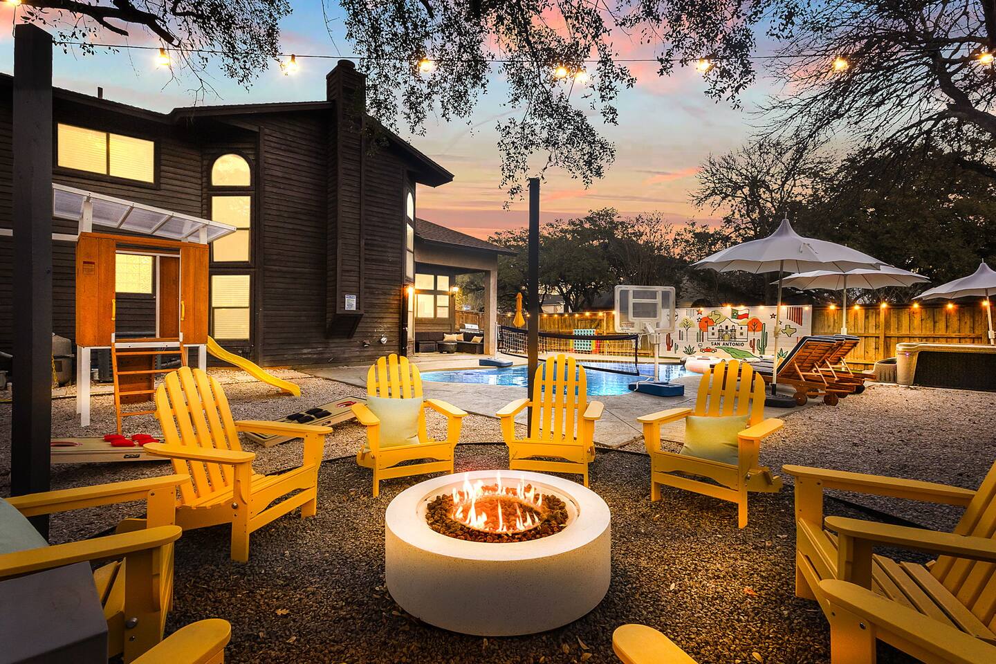 Evenings here glow with magic—firepit crackling, string lights twinkling, and the pool just steps away. ✨