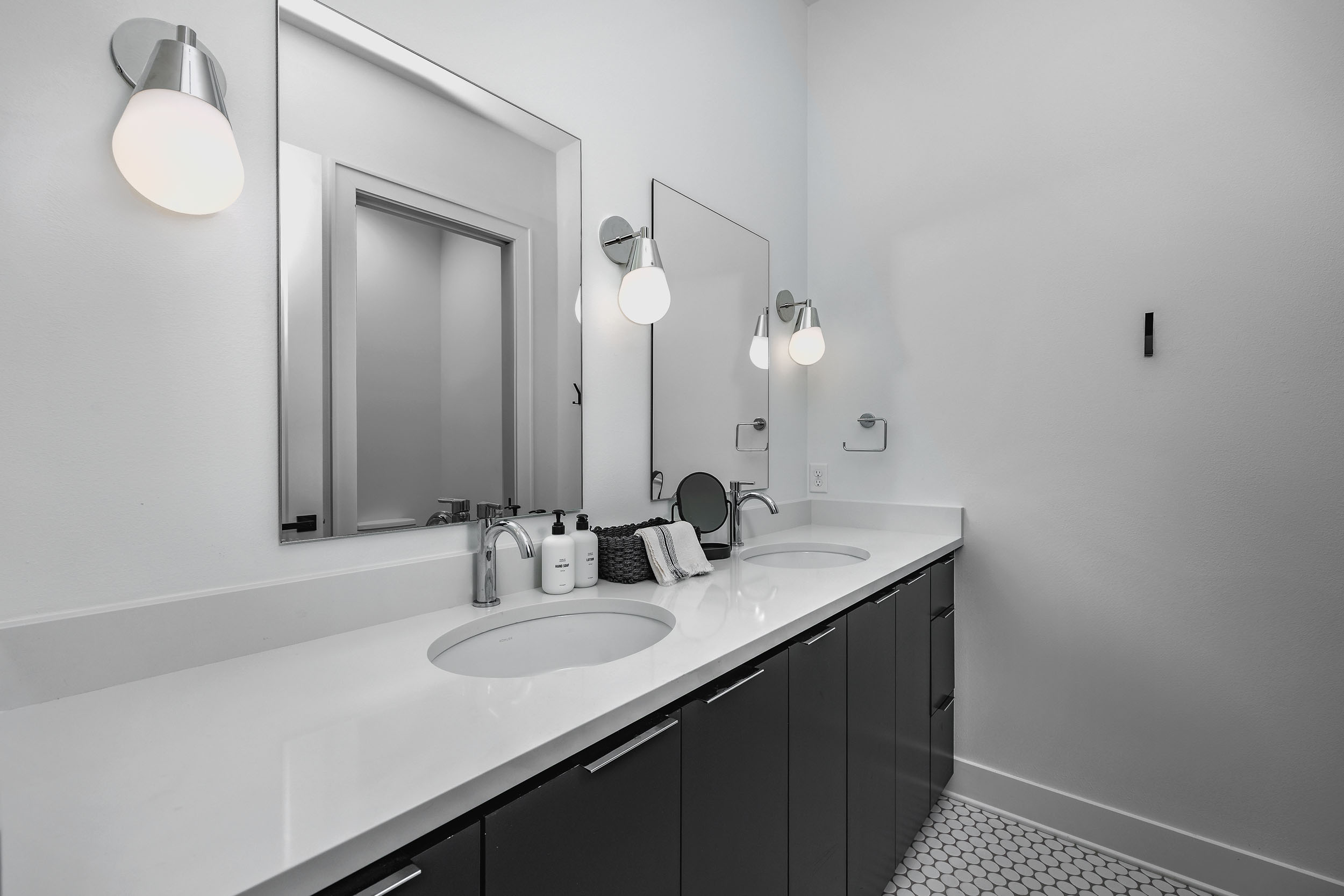 This hall bathroom is shared by the adjacent king bedroom, twin bedroom, and the hall day beds.