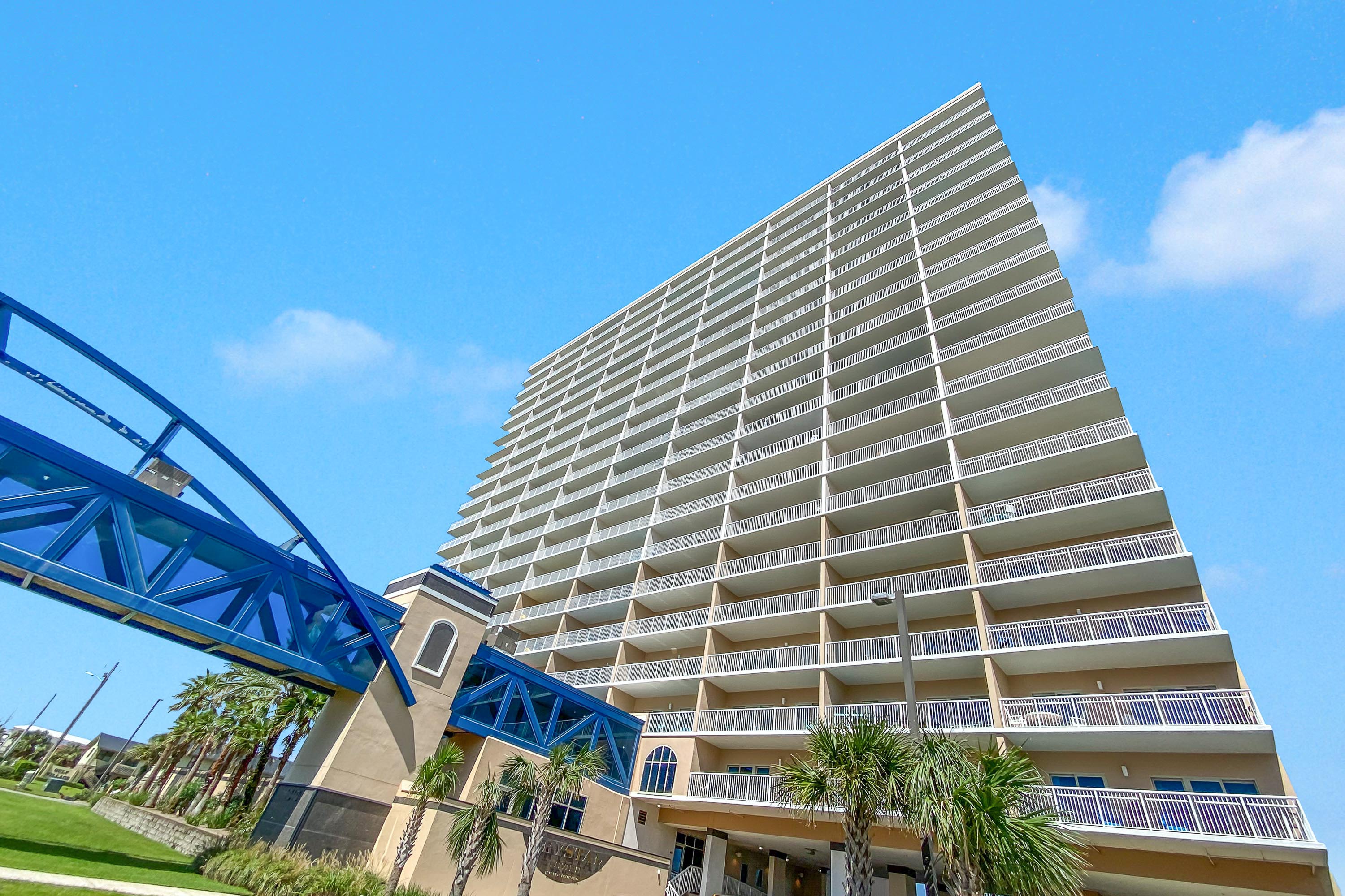 The distinguished Crystal Tower in Gulf Shores. The unique, enclosed sky bridge provides direct, convenient access to the beach, ensuring a seamless luxury experience for all guests and residents.