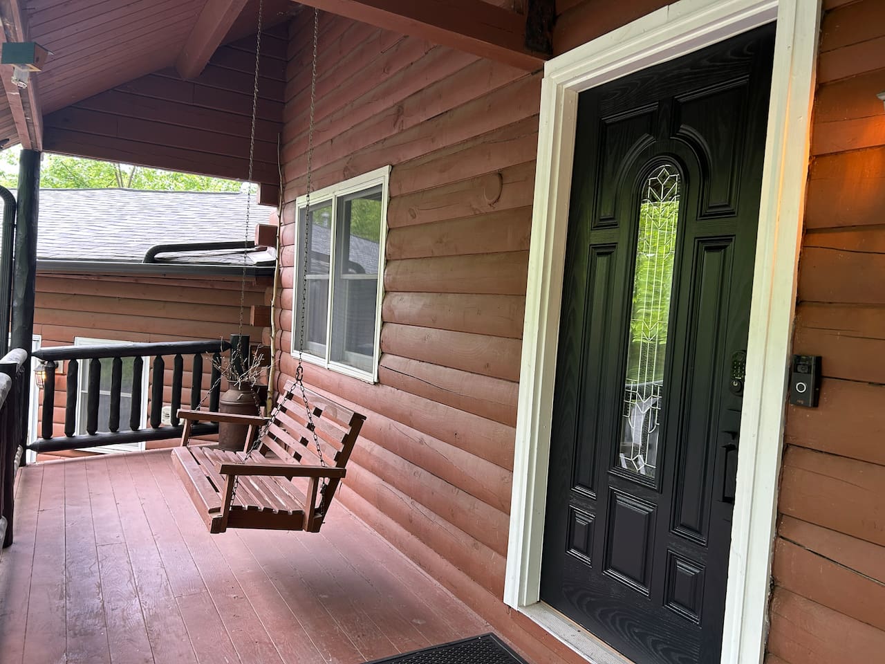 Swing on cabin front porch. Great place to listen to birds and watch deer. 