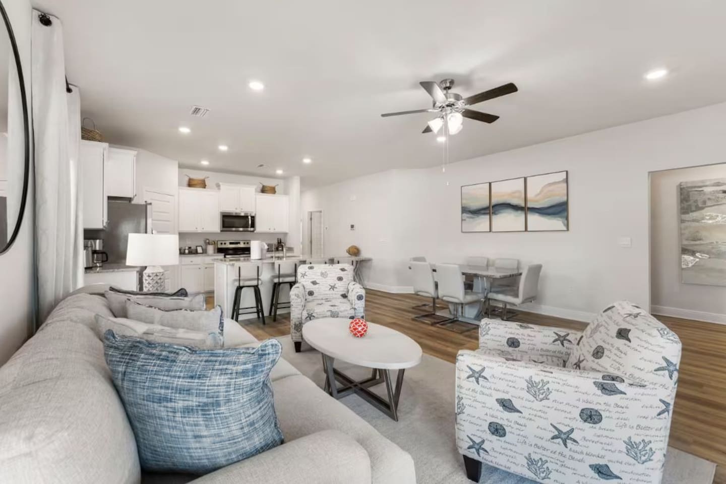 Kick back on plush couches and enjoy effortless indoor flow to the dining area and full kitchen.