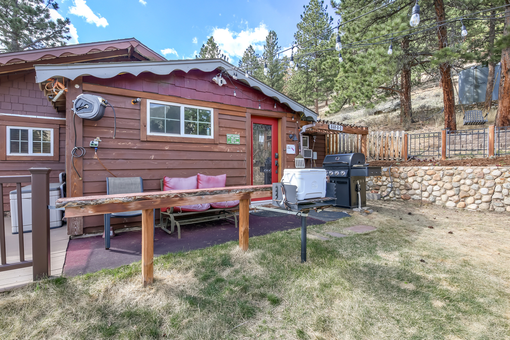 Outdoor seating area surrounded by trees and fresh mountain air.