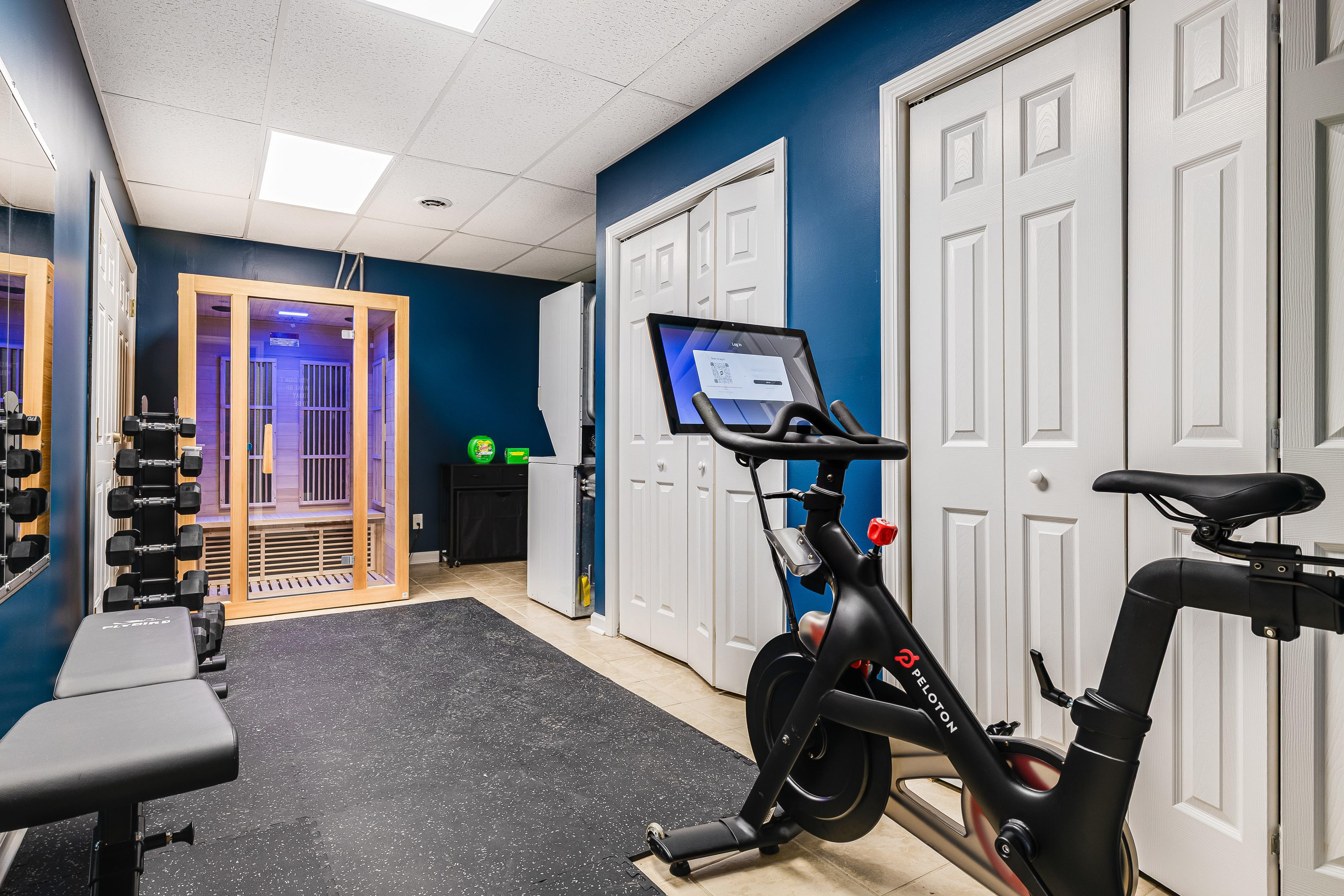 Our private gym features a Peloton bike, a dedicated workout bench with free weights, foam flooring, and a relaxing sauna, providing everything you need to stay on top of your fi