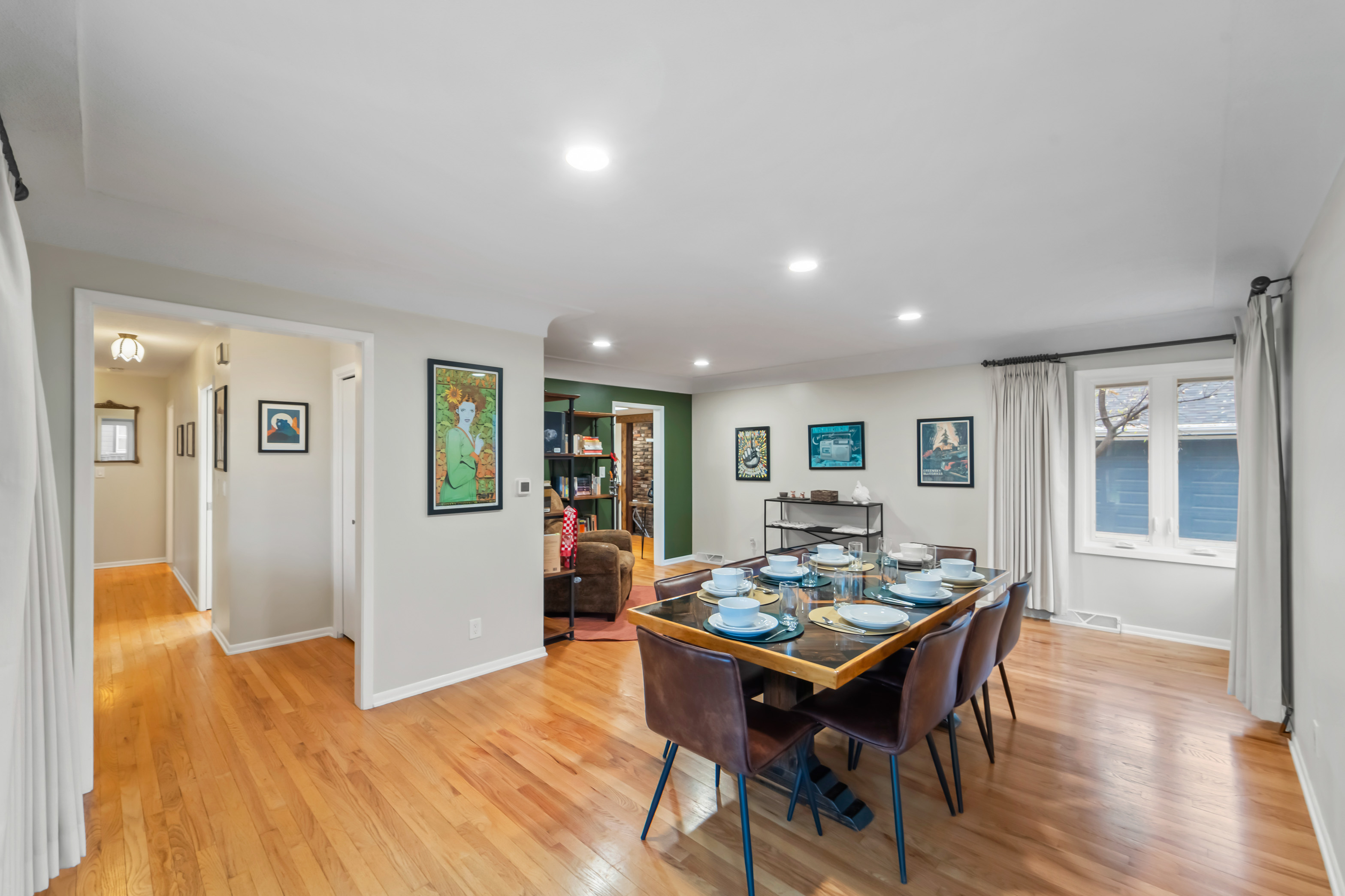 An overview of the dining room and reading nook. We call this room, "The Room of Requirement" for all the Harry Potter fans. As this room typically turns into whatever we need it for: yoga, in-home massage, 1000-piece puzzles, kids play area, etc. 